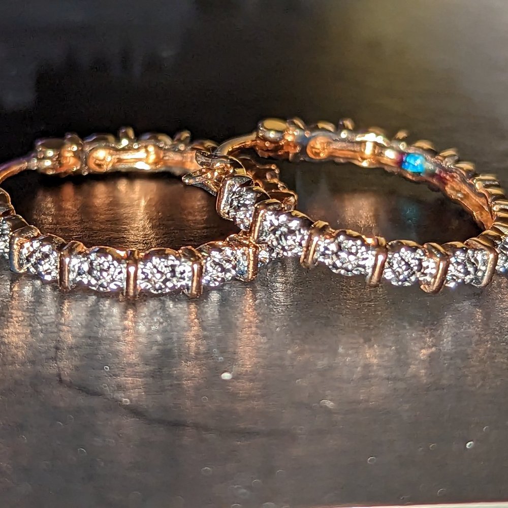 Genuine diamond accents in 18k yellow gold over sterling silver hoops